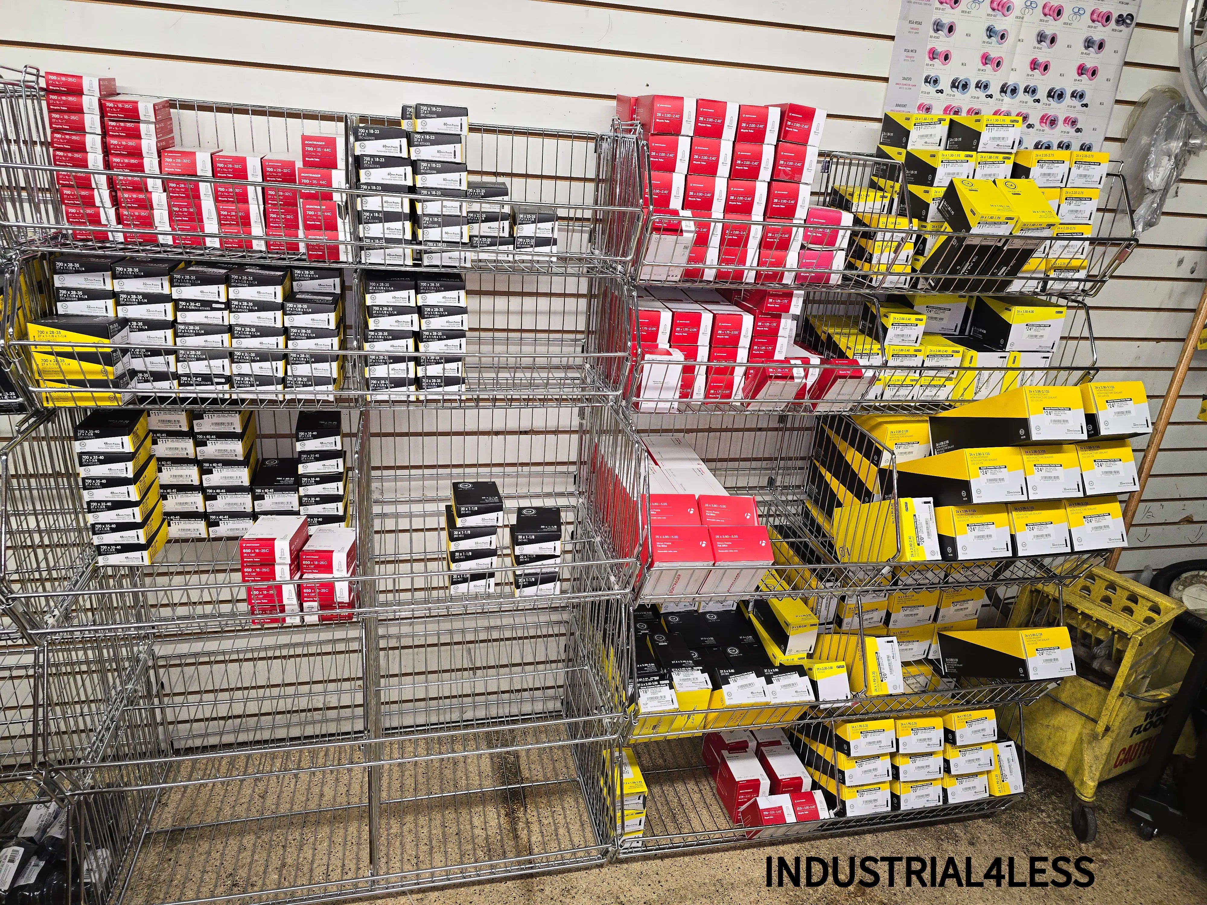 Wire basket shelving used in retail or parts store to organize and display boxed inventory for easy access and restocking