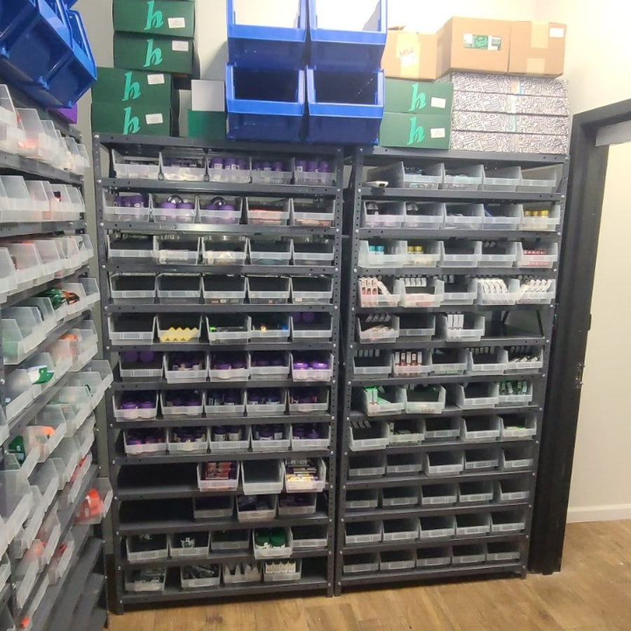 Clear bins keep packaged inventory separated.