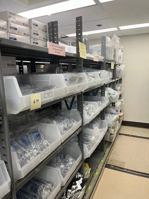 Large Clear Stacking Bins on Shelving Unit