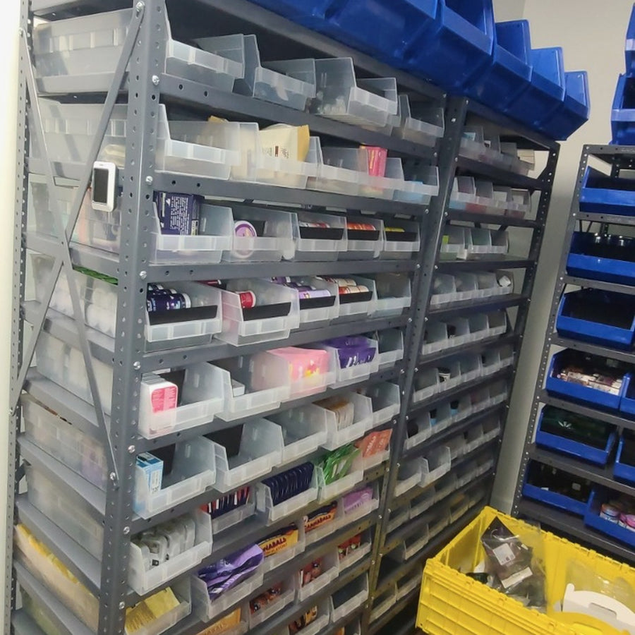 Different package sizes organized on adjustable shelves.