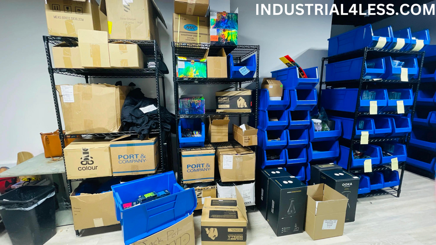 Blue bins and reserve cartons in a working stockroom.