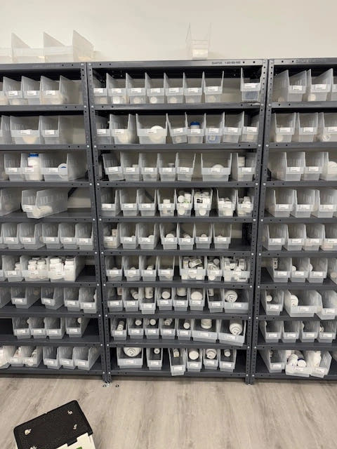 Pharmacy shelving with clear bins